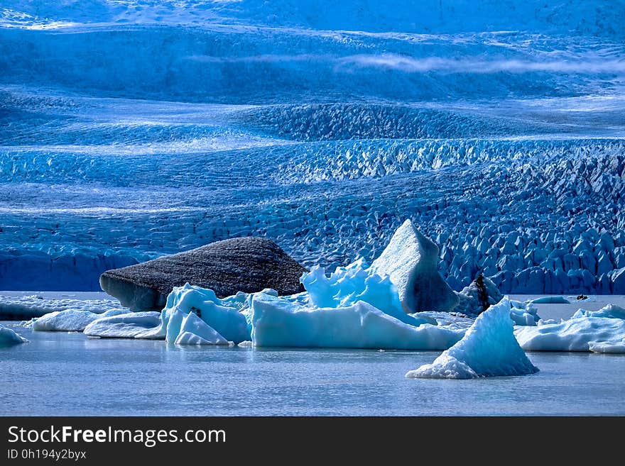 Icy shores and ice floes on the sea.