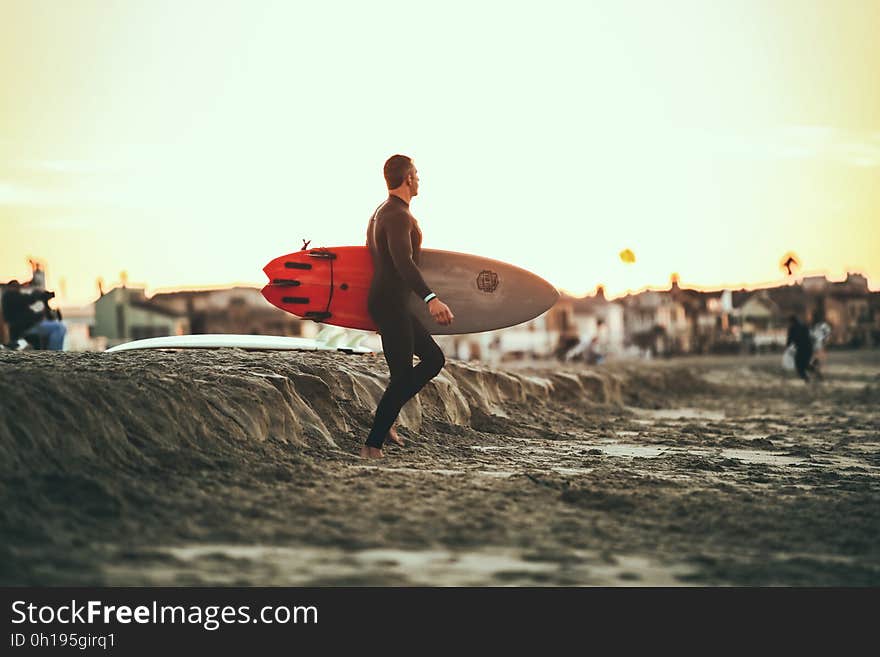 A surfer about to hit the waves.