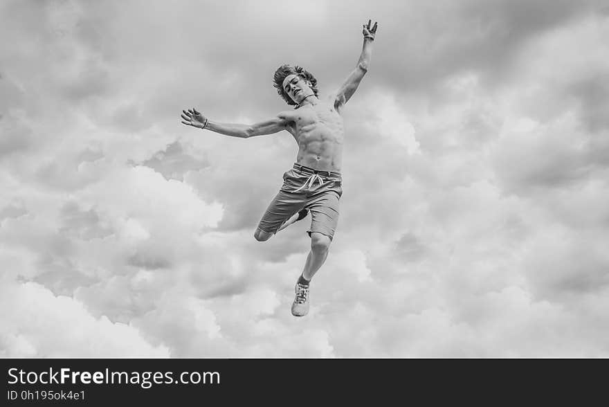 A black and white photo of a man falling from the sky. A black and white photo of a man falling from the sky.