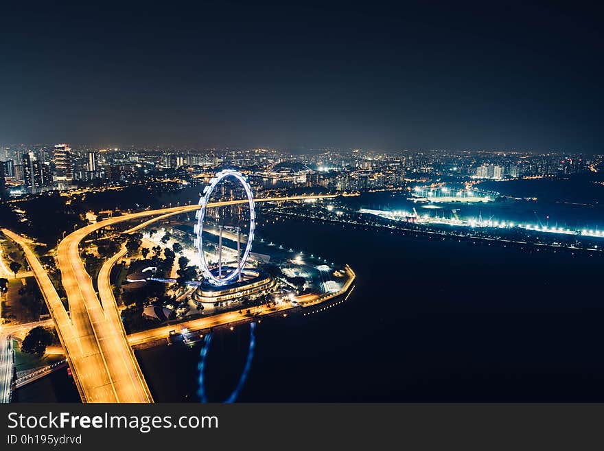 Singapore skyline and the Singapore Flyer at night. Singapore skyline and the Singapore Flyer at night.