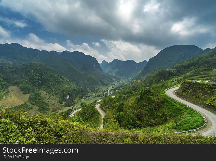 Road Near Mountain Under Cloudy Weather