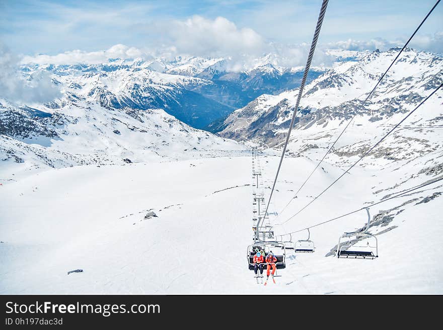 A mountain ski resort with a chair lift. A mountain ski resort with a chair lift.