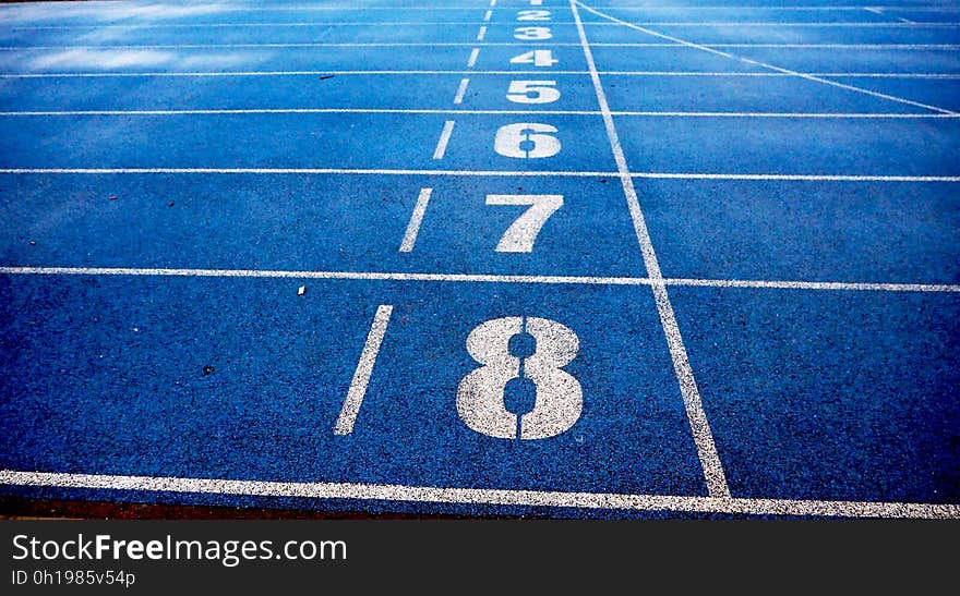 Empty race track with number painted on them.