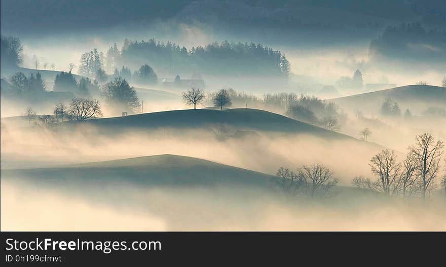 A sunrise on hills with mist. A sunrise on hills with mist.