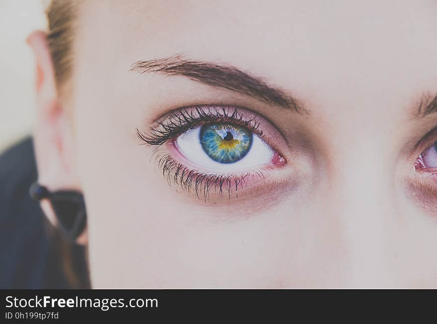 A closeup of a young woman's face. A closeup of a young woman's face.