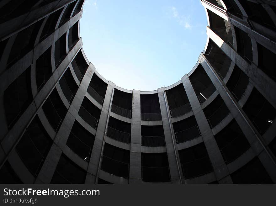 Low angle of modern architecture exterior against blue skies. Low angle of modern architecture exterior against blue skies.