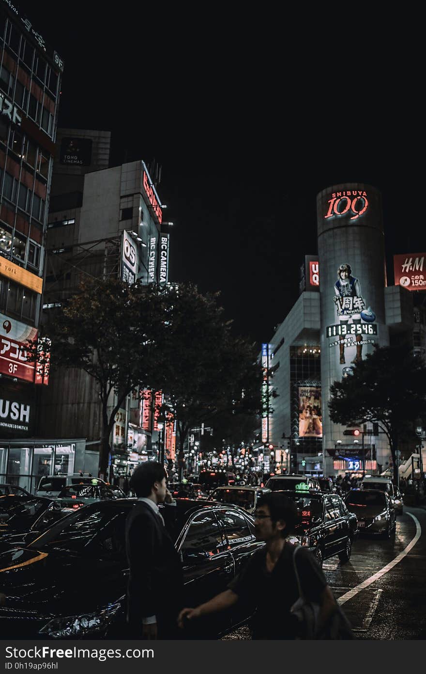 Cars in traffic in downtown Tokyo, Japan illuminated at night. Cars in traffic in downtown Tokyo, Japan illuminated at night.