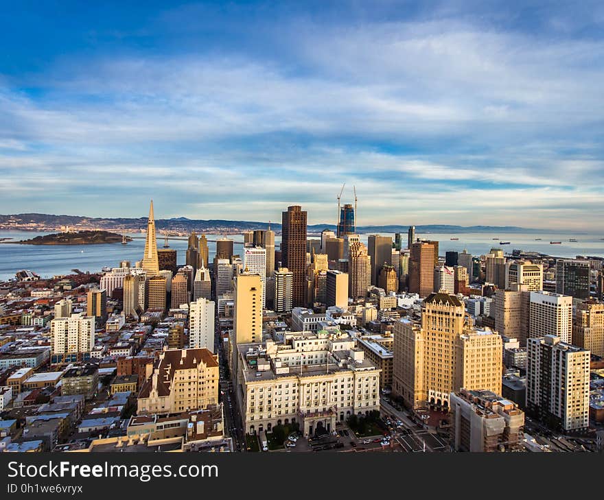 High Angle View of Cityscape Against Cloudy Sky