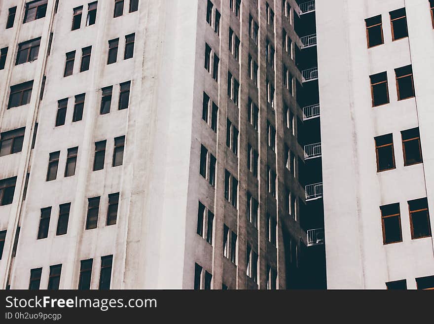 White Concrete Building With Glass Windows