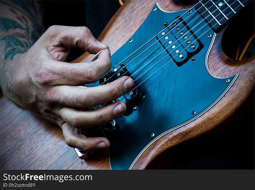 Brown and Black Electric Guitar