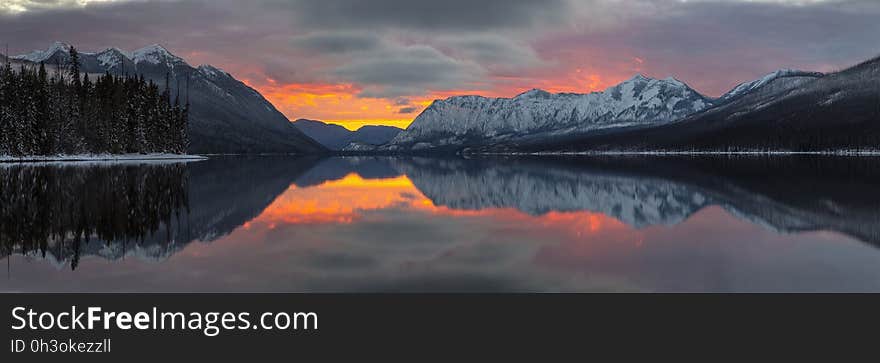 Reflection of Mountains in Lake during Sunset