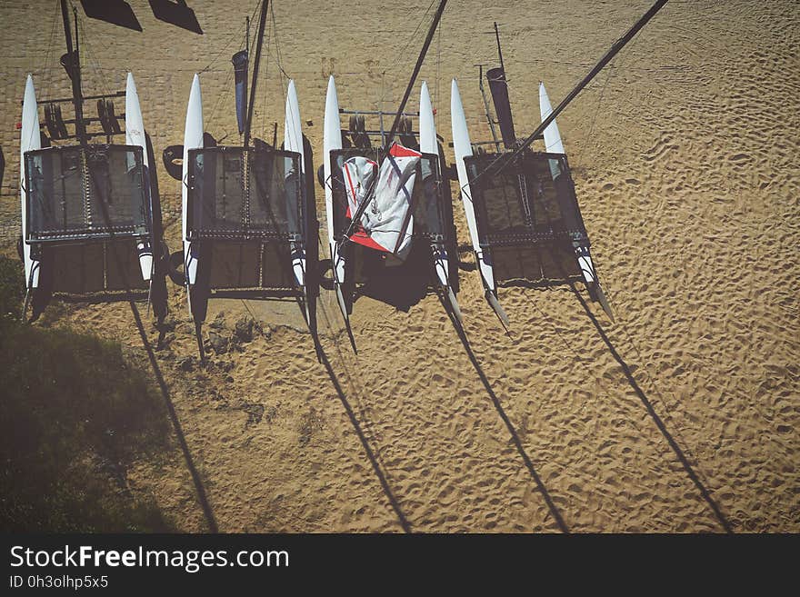 Areal View of 4 White Inflatable Boat on Brown Sands during Daytime