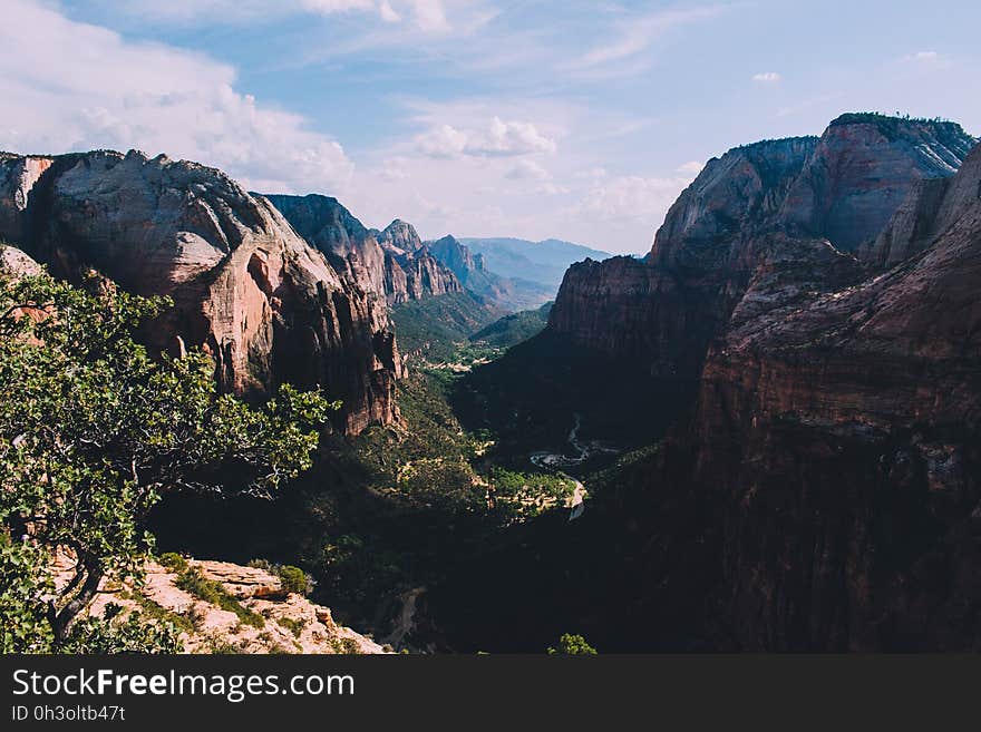 Scenic View of Mountains Against Cloudy Sky