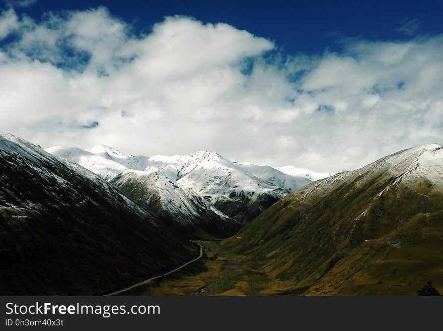 Snowy Mountains Under Blue Sky during Daytime