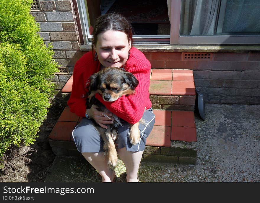 wife with the dog on her lap