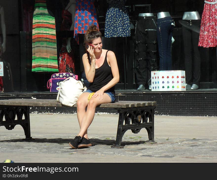 Woman on phone with banana