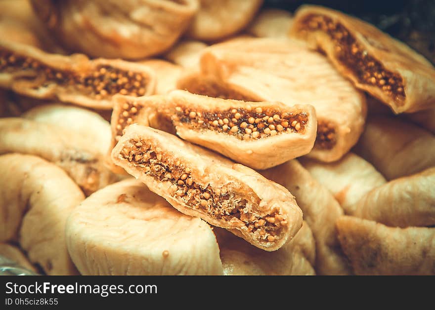 Dried fruits background, dried figs close-up, selective focus, toned picture. Dried fruits background, dried figs close-up, selective focus, toned picture