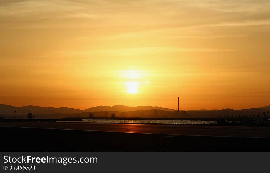 Silhouette of Mountain Under Sunset