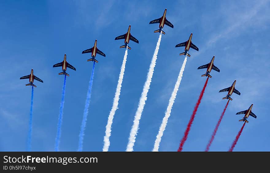 Nine Alpha Jets from the French Air Force fly over the Champs-Elysées, releasing trails of blue, white and red smoke, colours of the French national flag. Nine Alpha Jets from the French Air Force fly over the Champs-Elysées, releasing trails of blue, white and red smoke, colours of the French national flag.