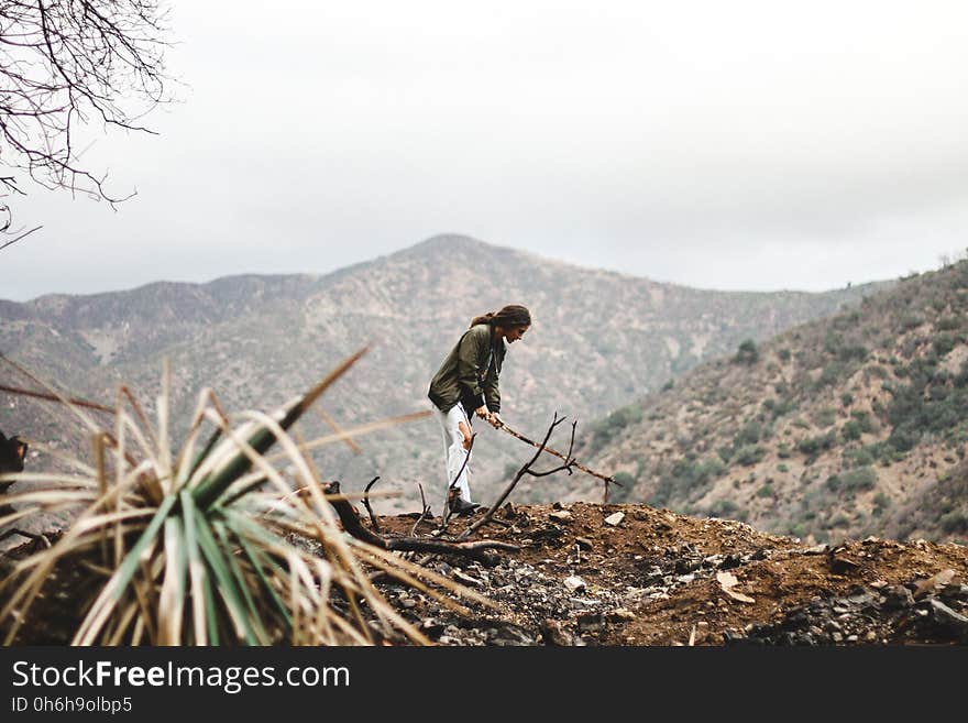 Full Length of a Young Man With Mountain in Background