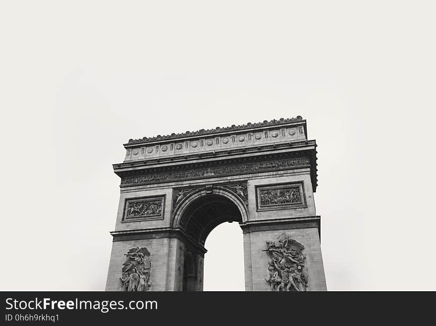 Grayscale Photo of Concrete Tower