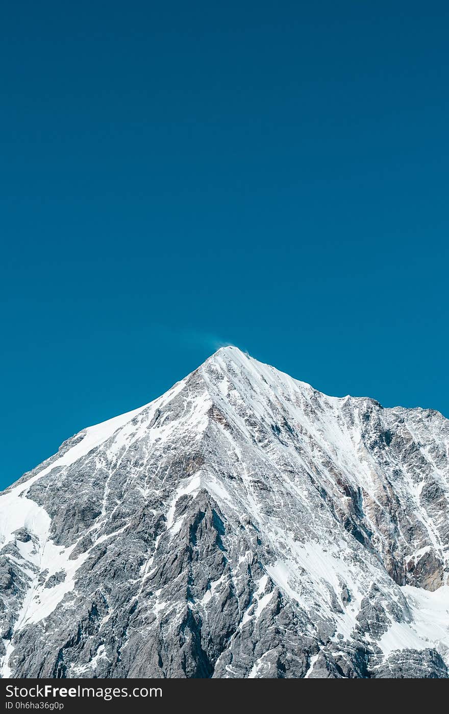 Snowy Mountain Under Clear Blue Sky