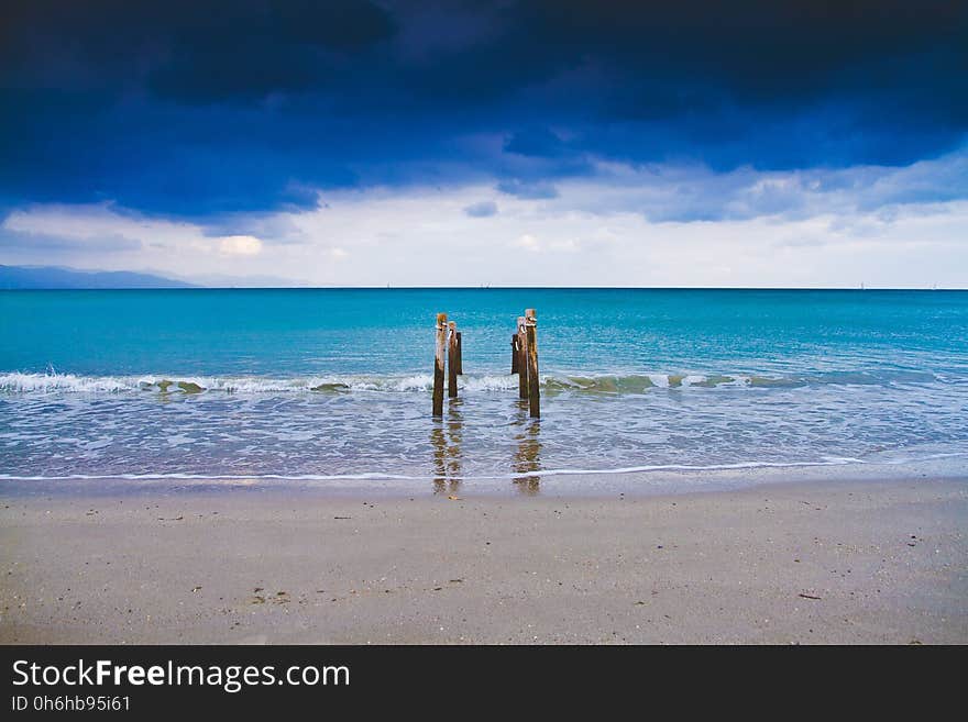 Sea Under Blue and White Cloudy Sky during Daytime