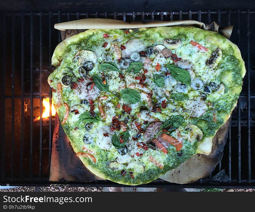 Home made crust and fresh spinach pesto sauce, with salami, mushrooms, red pepper, and olive. Home made crust and fresh spinach pesto sauce, with salami, mushrooms, red pepper, and olive