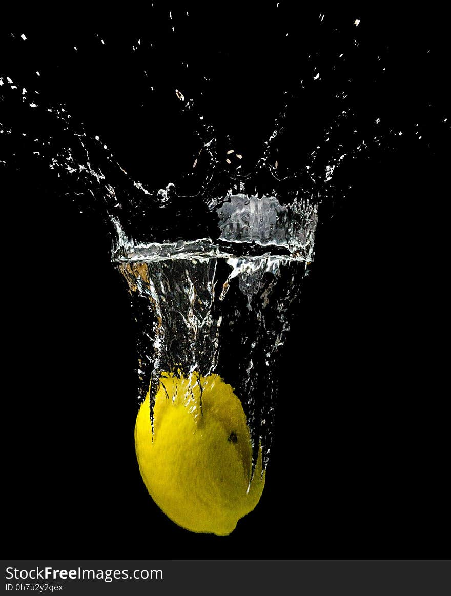 Yellow Lemon Submerged in Water