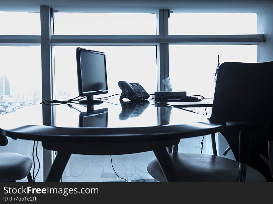 Chairs on Table Against Window