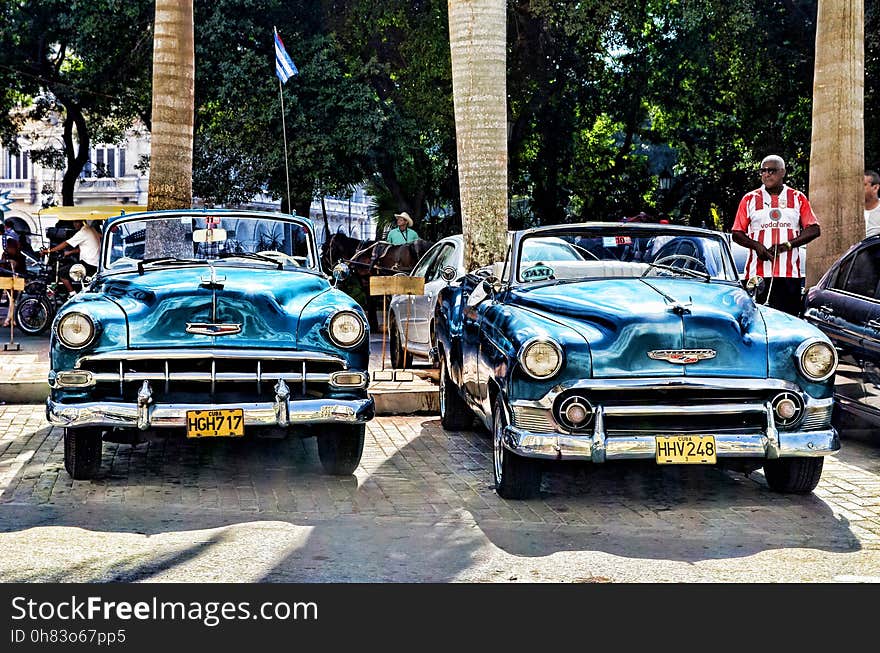 Blue Convertible Vintage Car Parked during Daytime