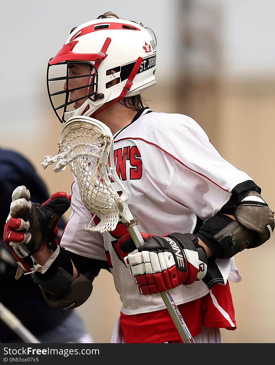 Man Wearing White and Red Lacrosse Uniform