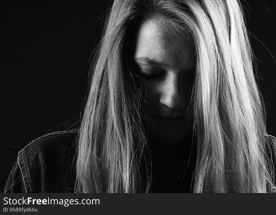 Woman in Shirt With Her Hair Half Covering Her Face