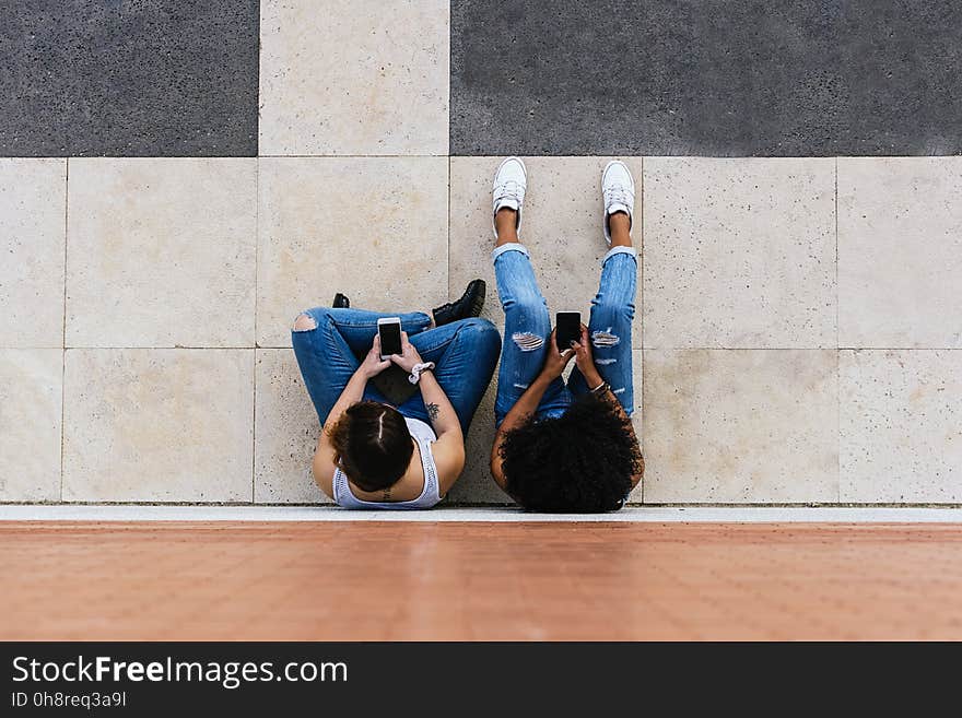 Beautiful women using a mobile in the Street. Youth concept.