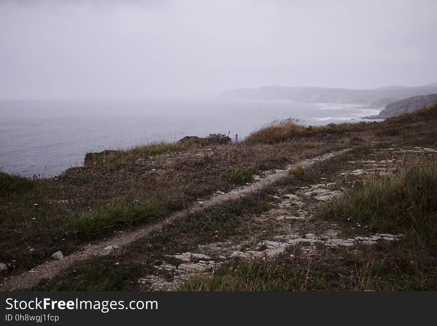 Sky, Plant, Water, Slope, Mountain, Coastal and oceanic landforms