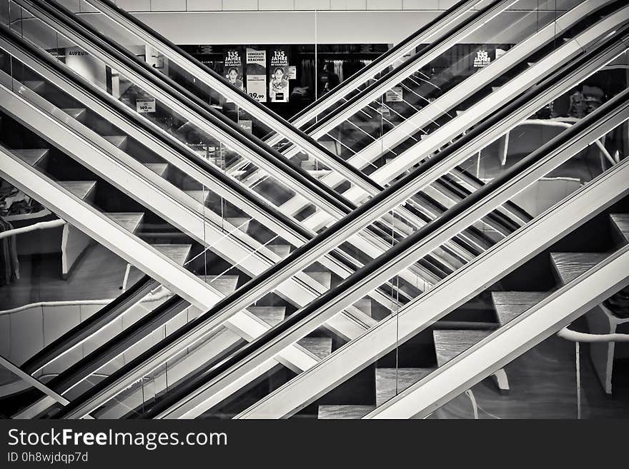 Grayscale Photography of Staircases With Handrails