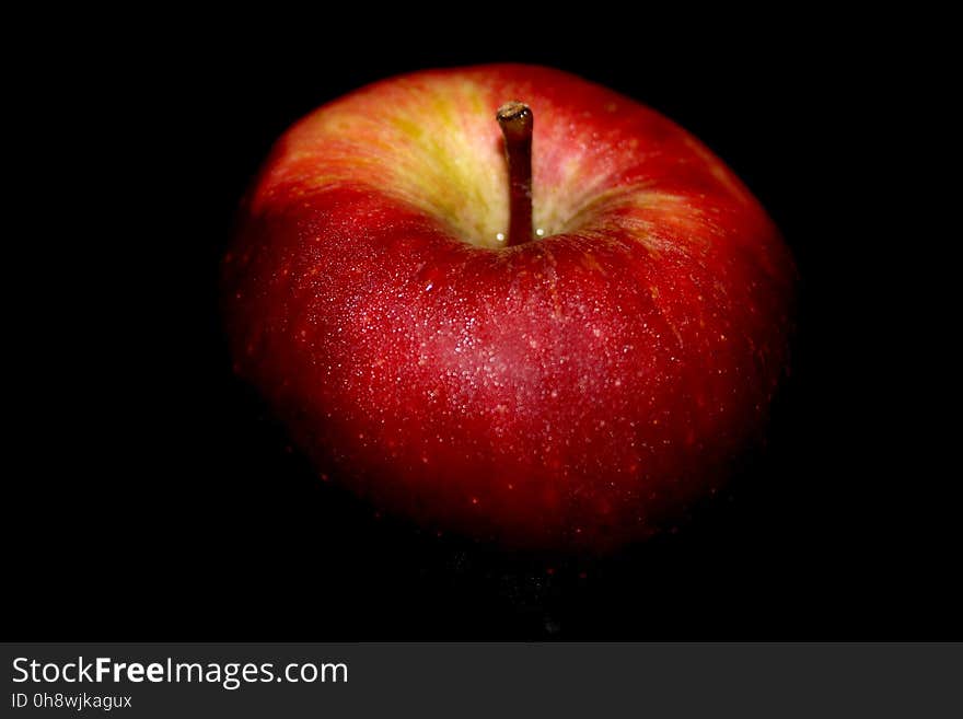 Close-up of Apple Against Black Background