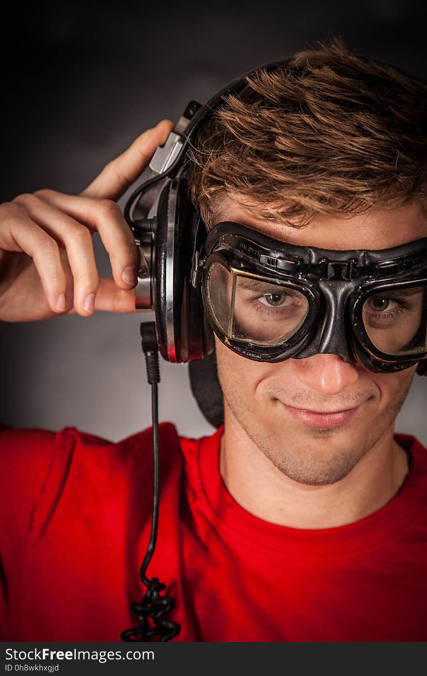 Man Wearing Red Crew Neck Shirt and Black Goggles