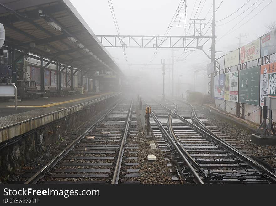 Railroad Tracks in City Against Sky