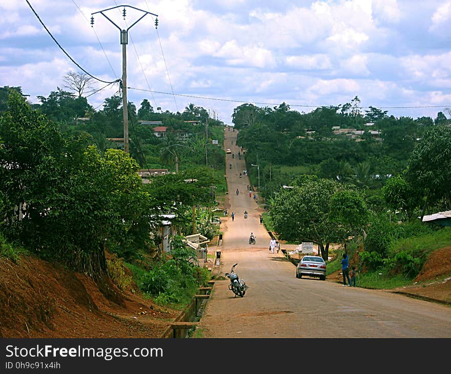 A street leading up a hill in Sangmelima, Cameroon - a town of 50000 in the middle of the jungle. A street leading up a hill in Sangmelima, Cameroon - a town of 50000 in the middle of the jungle.