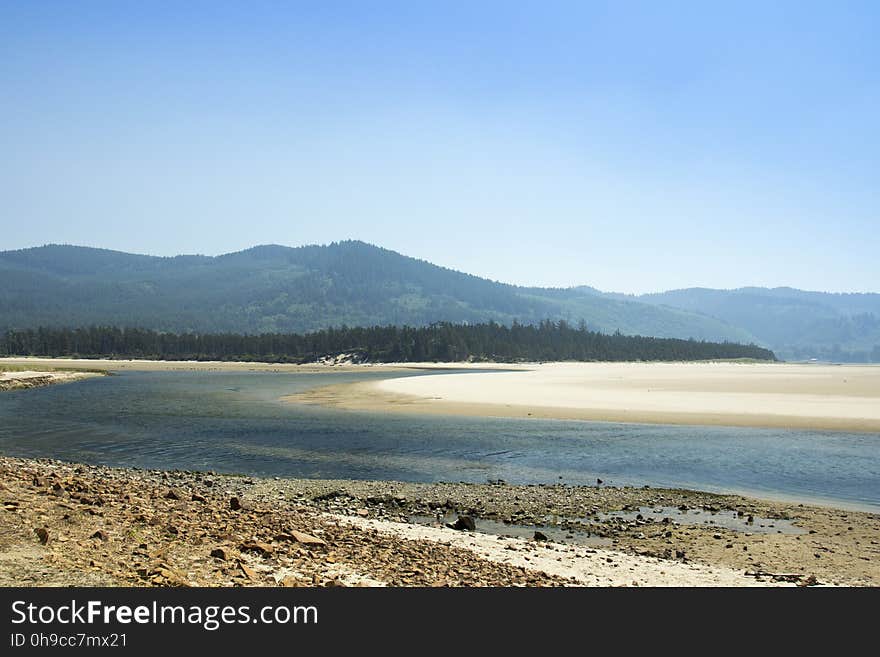 Tidal lake with the Pacific Ocean and end point of Sand Creek. Tidal lake with the Pacific Ocean and end point of Sand Creek.