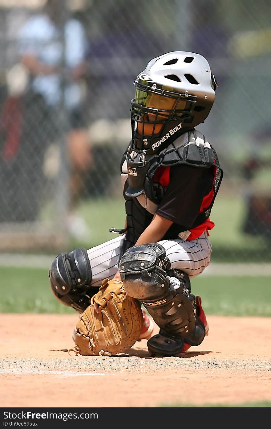 Boy in Black Power Balt Baseball Helmet