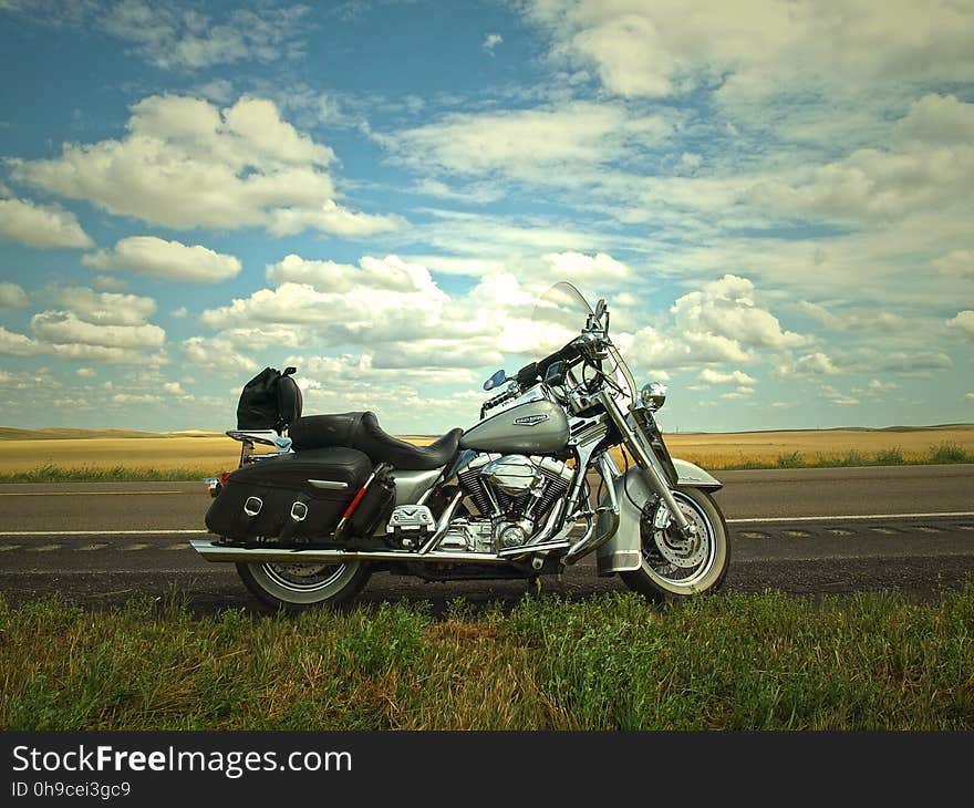 Gray and Silver Cruiser Motorcycle Near Green Grass Lawn