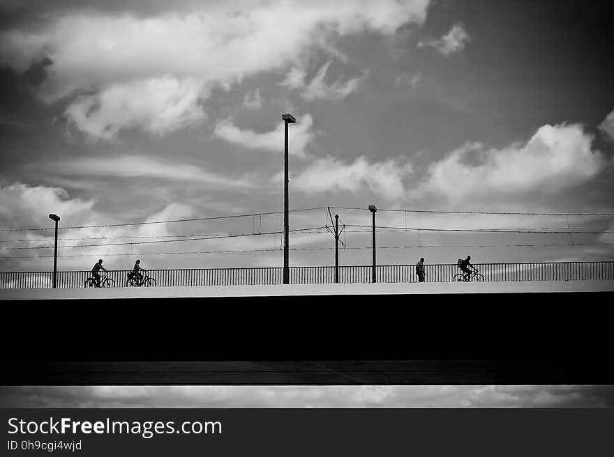 People Riding on Bicycle during Daytime