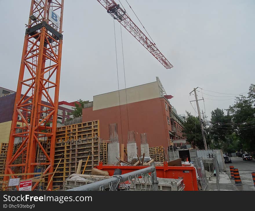 A homeless guy climbed this crane, at Jarvis and Dundas, on 2017-08-02, to protest building luxury condos, not affordable homes -e