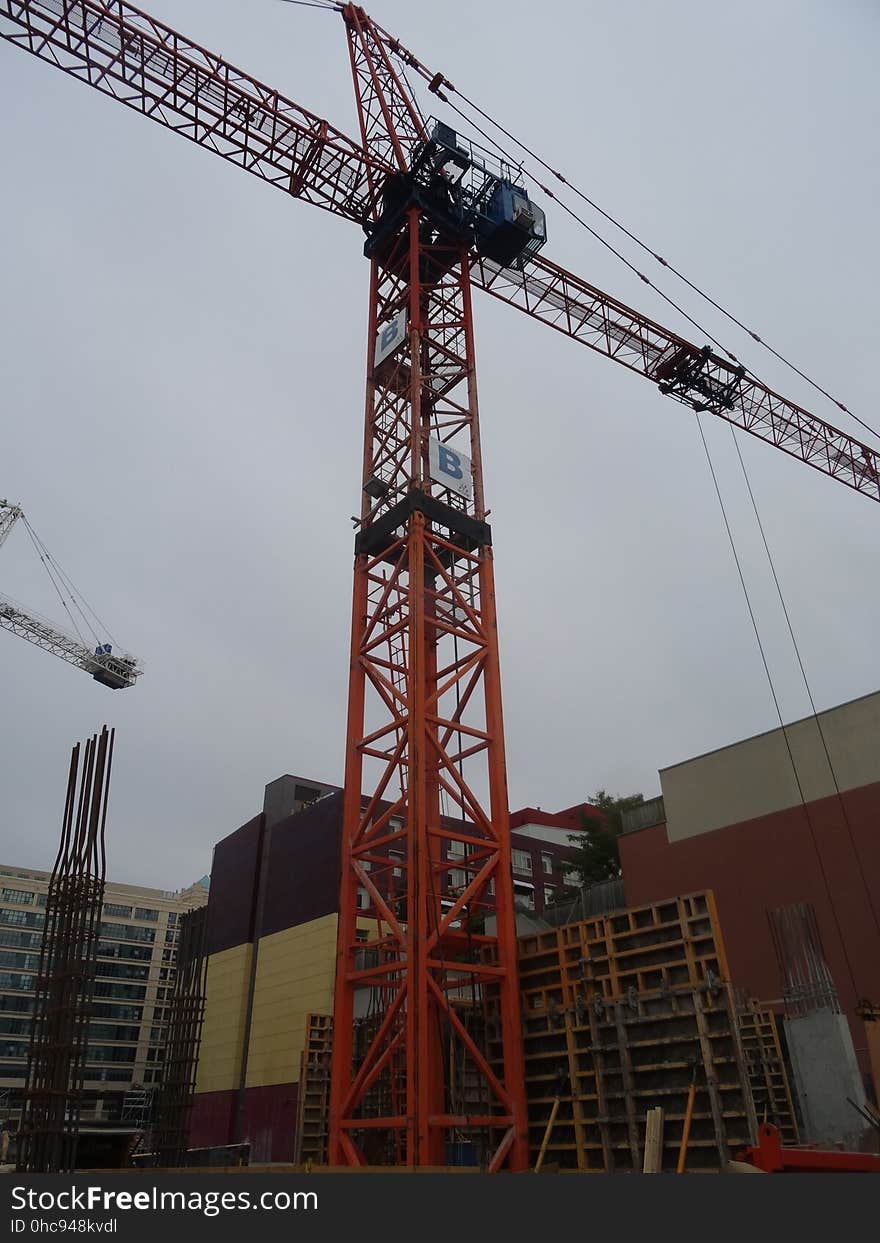 A homeless guy climbed this crane, at Jarvis and Dundas, on 2017-08-02, to protest building luxury condos, not affordable homes -a