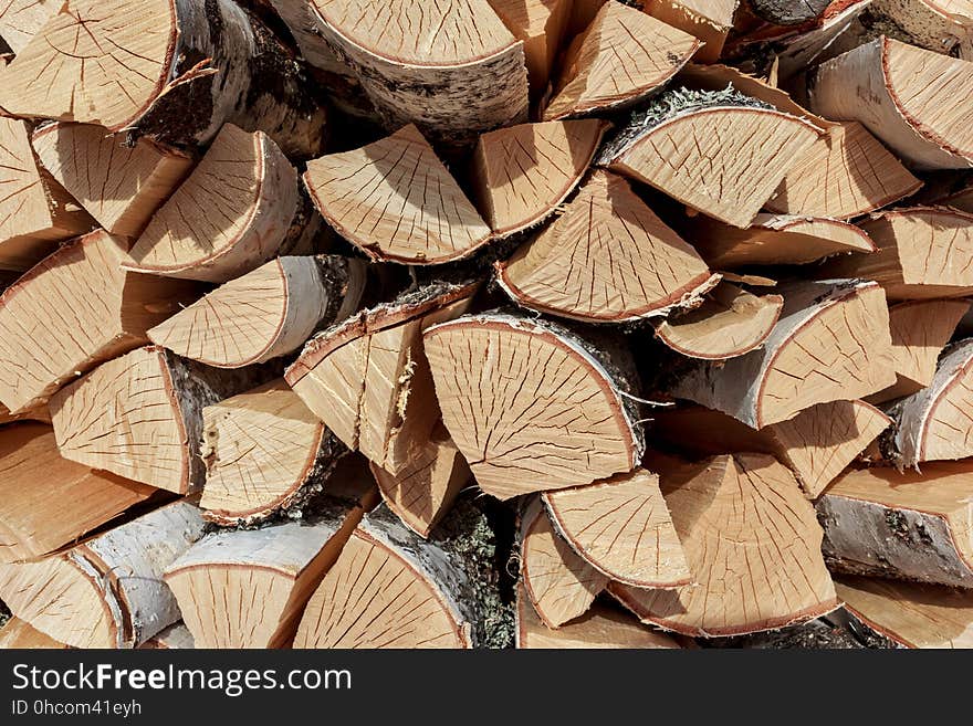 Birch split firewood stacked in the woodpile