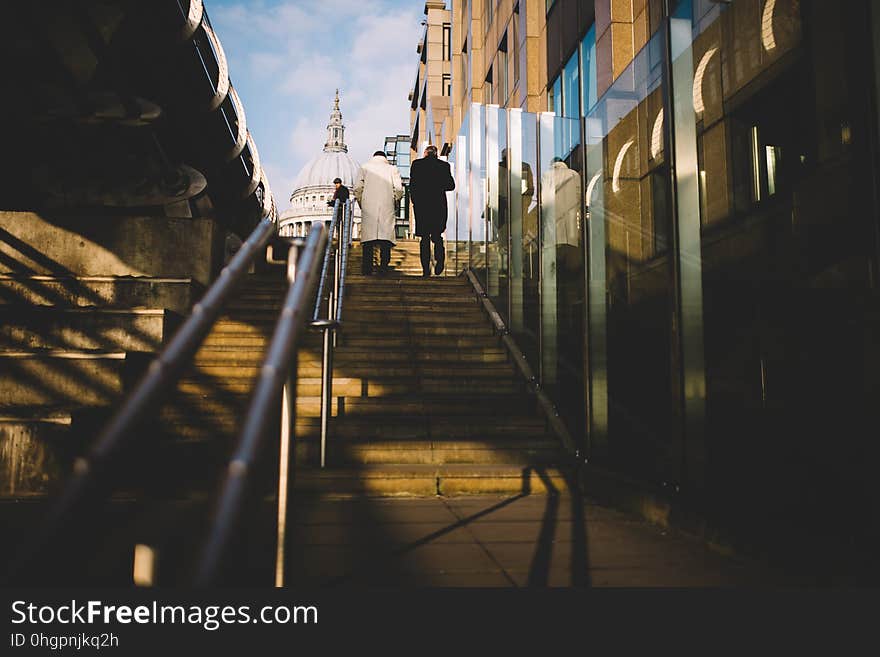 2 People Walking Up on Stairs