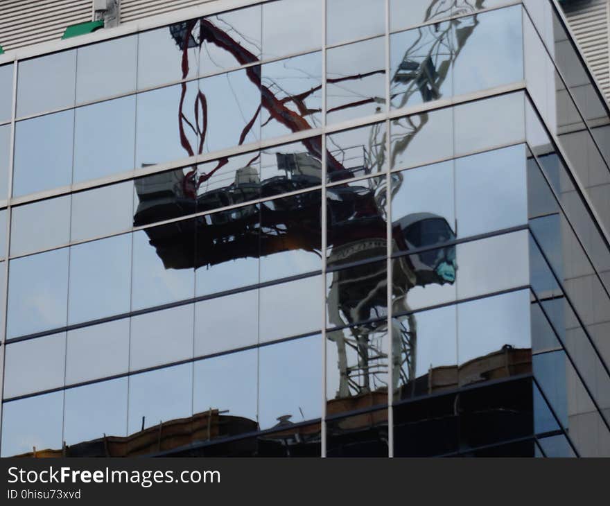 Reflection of the construction crane, at Massey Tower, on Yonge Street, 2017 08 22 -h