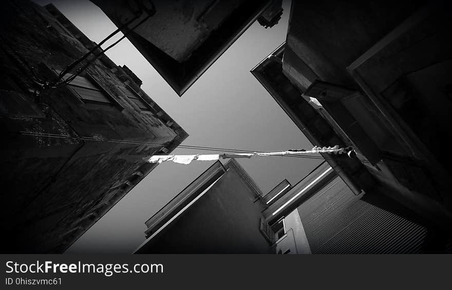 Angled view of black and white buildings.